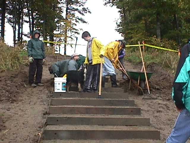 Scouts from Troop 676 help to build a set of stairs